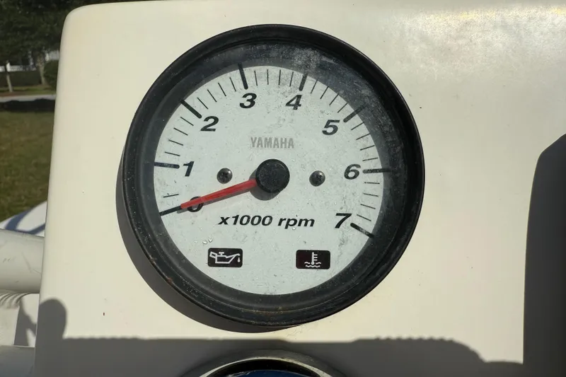 Slide: The Image of Yamaha tachometer on 2016 Robalo R160 Center Console, displaying RPM gauge. - 11