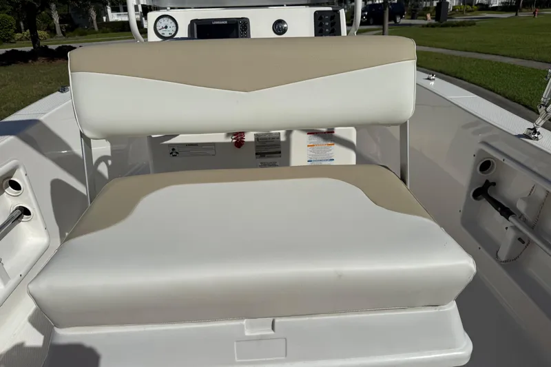 Slide: The Image of 2016 Robalo R160 Center Console boat seat and dashboard view. - 18