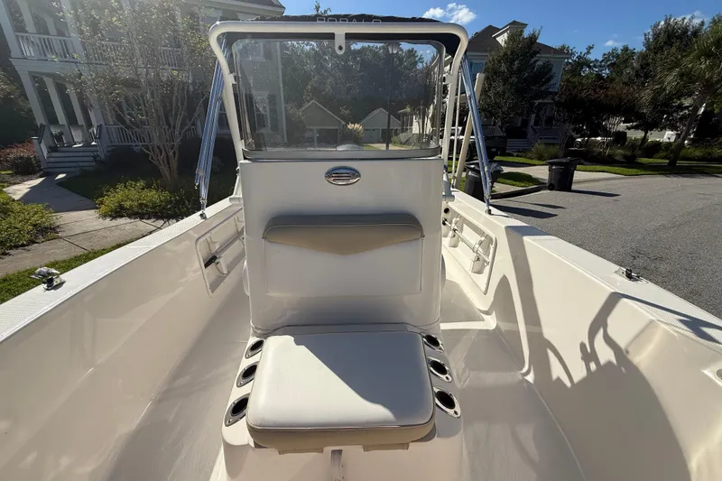 Slide: The Image of 2016 Robalo R160 Center Console boat interior with seating and console view. - 20