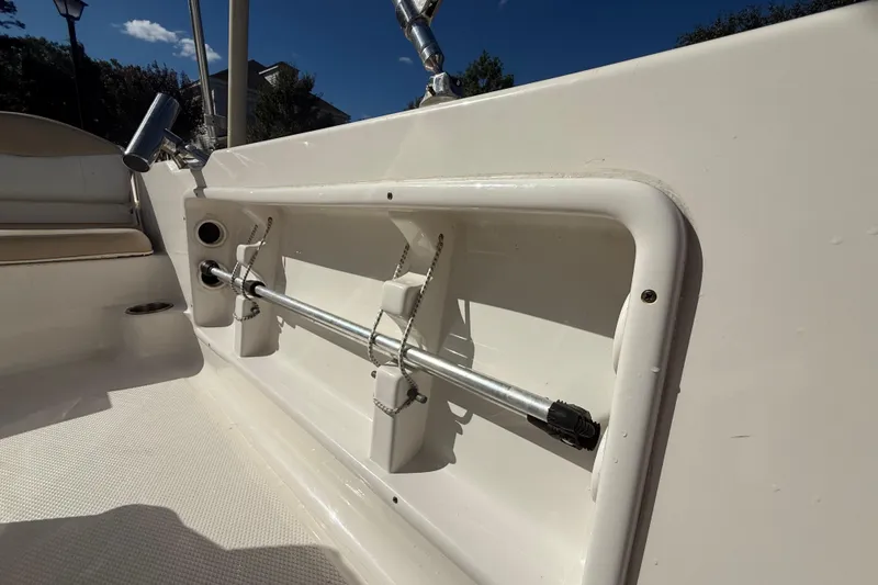 Slide: The Image of 2016 Robalo R160 Center Console boat interior with rod holder and seating. - 22