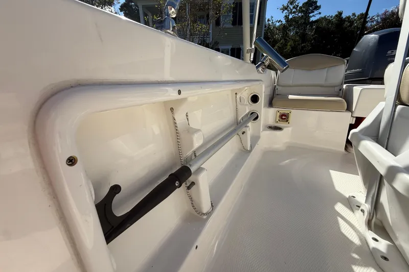 Slide: The Image of 2016 Robalo R160 Center Console interior with rod holder and seating. - 23