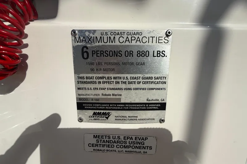 Slide: The Image of 2016 Robalo R160 Center Console capacity plate, 6 persons or 880 lbs, 90 HP motor. - 24