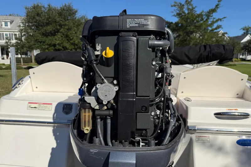 Slide: The Image of 2016 Robalo R160 Center Console with Yamaha outboard engine, parked outdoors. - 27