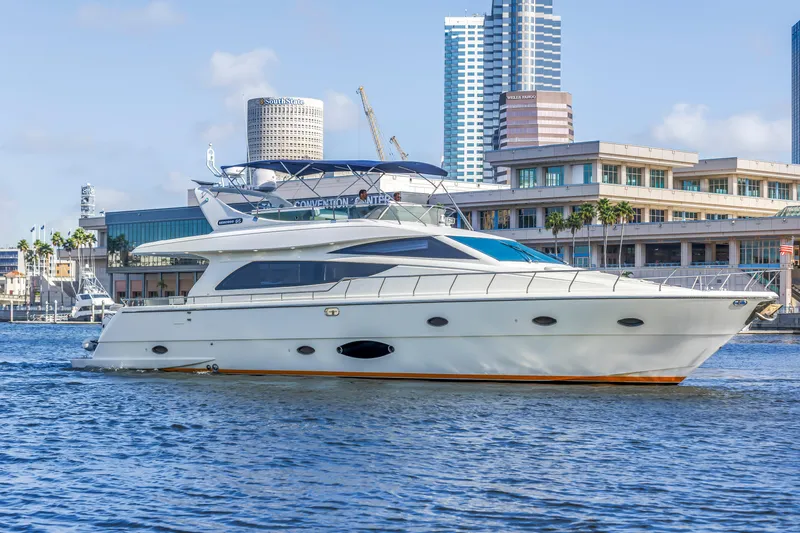 The Image of 2009 Uniesse 65 MY yacht cruising in urban waterfront setting. - 0