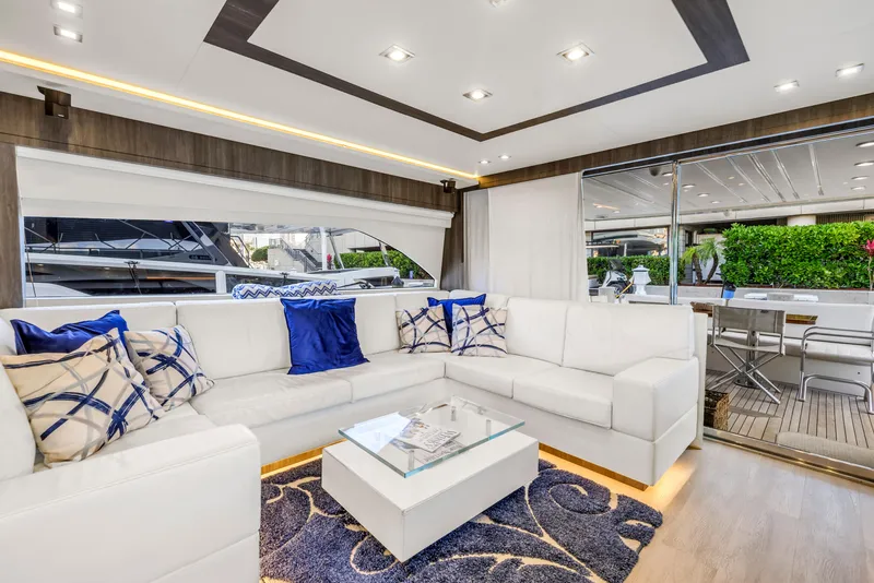 Slide: The Image of Luxurious interior of 2009 Uniesse 65 MY yacht with white seating and blue accents. - 11