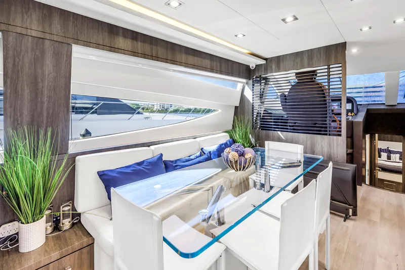 Slide: The Image of Luxurious interior of 2009 Uniesse 65 MY yacht with modern dining area. - 13