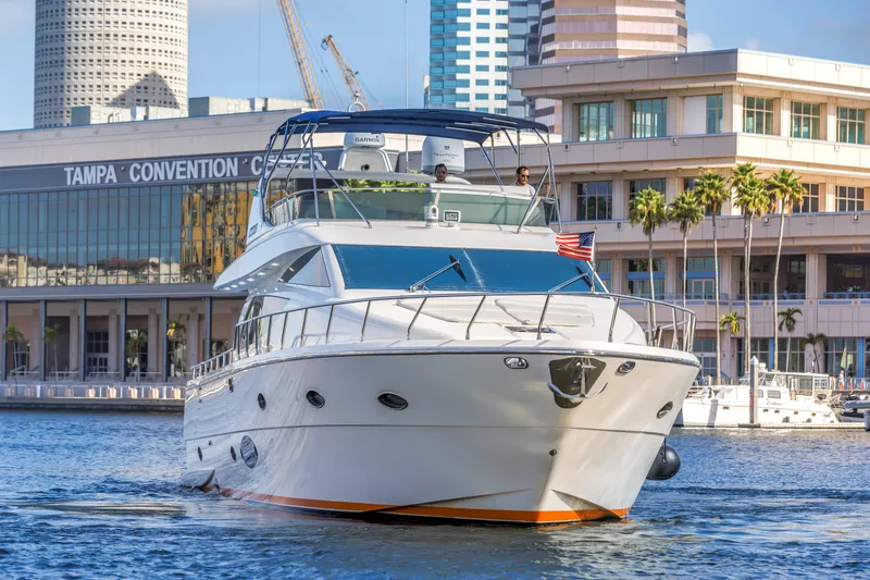 Slide: The Image of Luxury 2009 Uniesse 65 MY yacht cruising near Tampa Convention Center. - 2