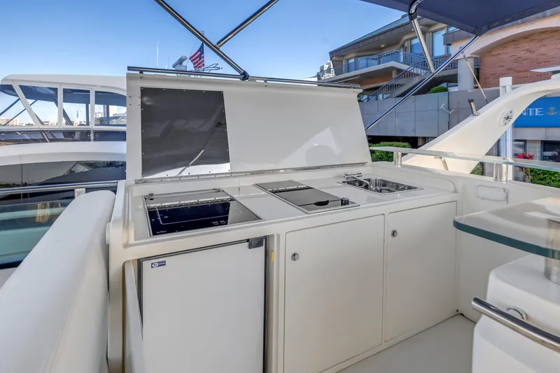 Slide: The Image of Outdoor kitchen on 2009 Uniesse 65 MY yacht with stove, sink, and fridge. - 28