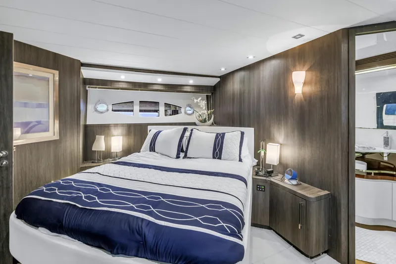 Slide: The Image of Luxurious bedroom interior of 2009 Uniesse 65 MY yacht with modern decor and elegant lighting. - 42