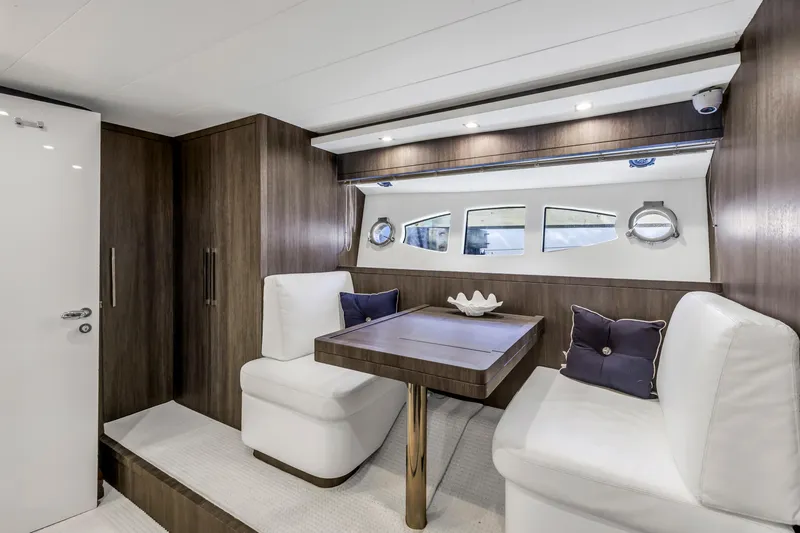 Slide: The Image of Luxurious interior of 2009 Uniesse 65 MY yacht with elegant seating and table. - 44