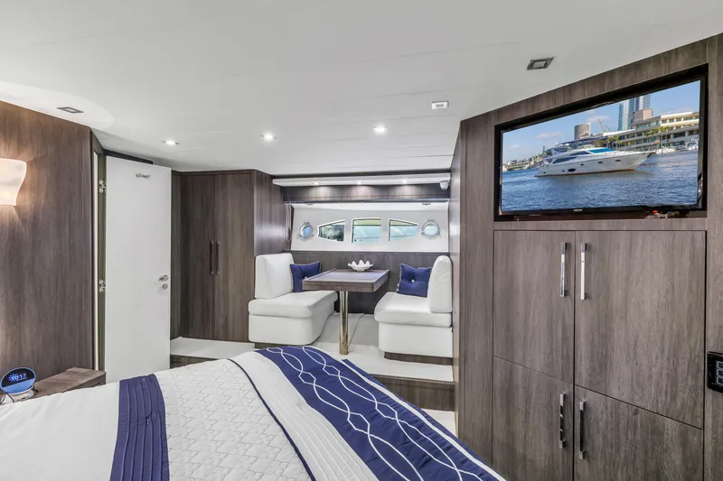Slide: The Image of Luxurious interior of 2009 Uniesse 65 MY yacht with modern furnishings and a mounted TV. - 46