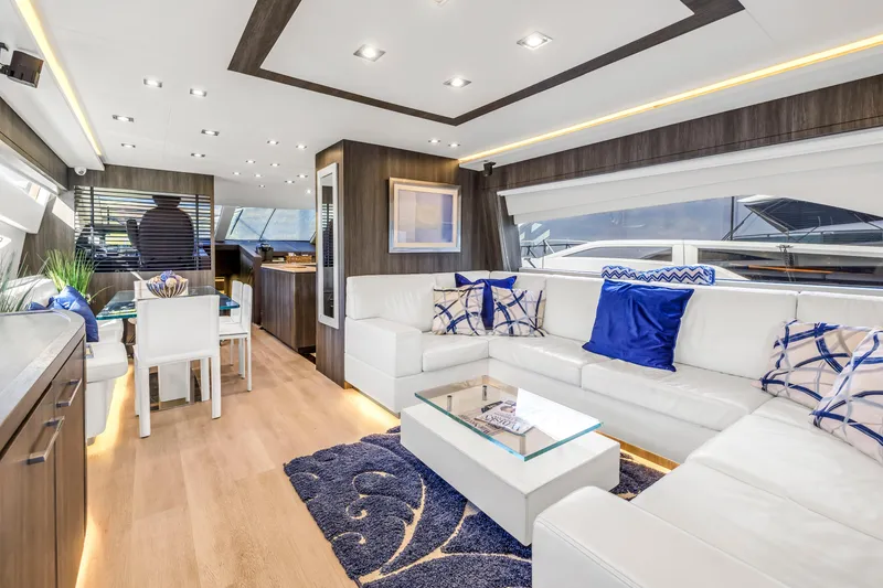 Slide: The Image of Luxurious interior of 2009 Uniesse 65 MY yacht with modern decor and white seating. - 8
