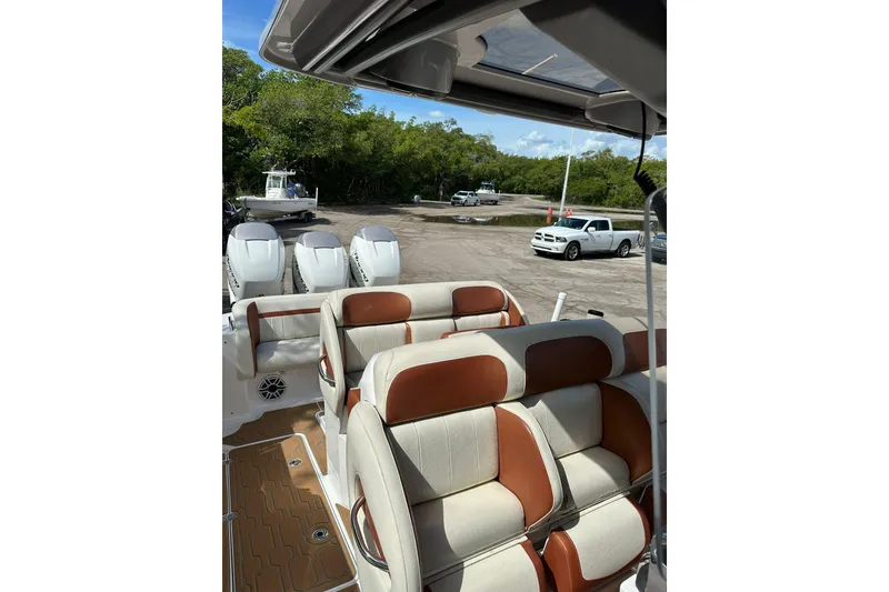 Slide: The Image of 2015 Nor-Tech 390 Sport Center Console with triple engines and luxurious seating. - 17