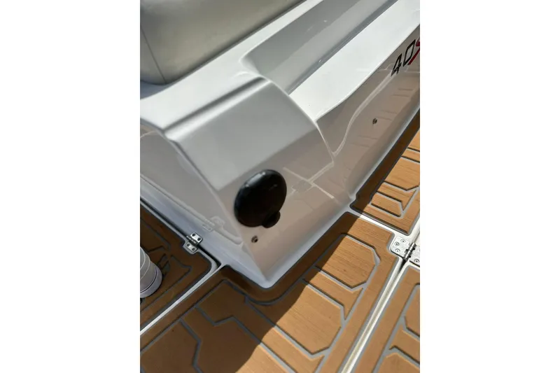 Slide: The Image of 2015 Nor-Tech 390 Sport Center Console interior detail with teak flooring. - 20