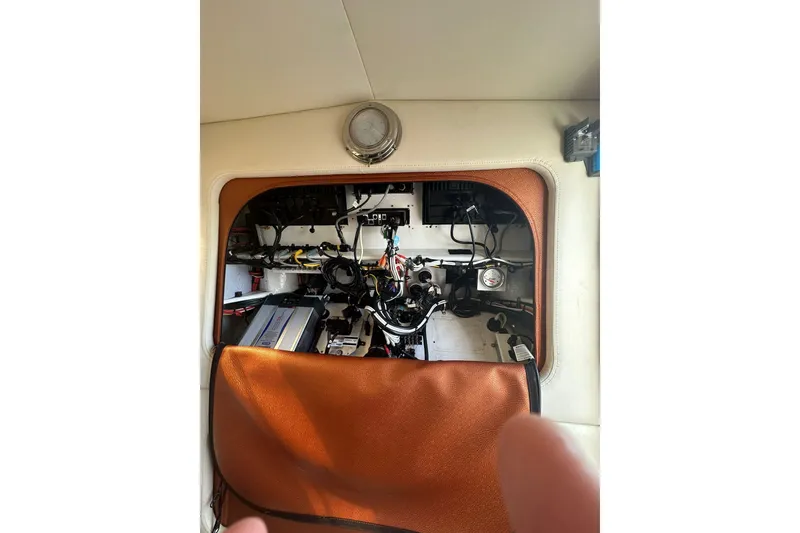 Slide: The Image of 2015 Nor-Tech 390 Sport Center Console interior wiring and components view. - 28