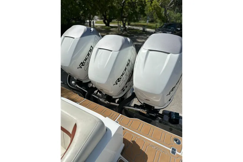 Slide: The Image of 2015 Nor-Tech 390 Sport Center Console with triple Racing outboard engines. - 5