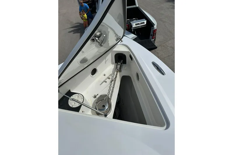 Slide: The Image of 2015 Nor-Tech 390 Sport Center Console anchor compartment with open hatch. - 8