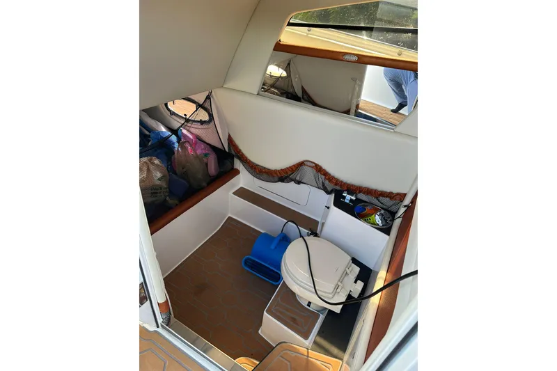 Slide: The Image of Interior of 2015 Nor-Tech 390 Sport Center Console boat with storage and seating area. - 9