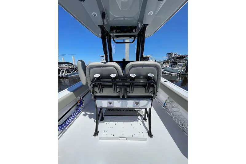 Slide: The Image of 2024 Sportsman Open 232 Center Console boat interior with seating and console view. - 20