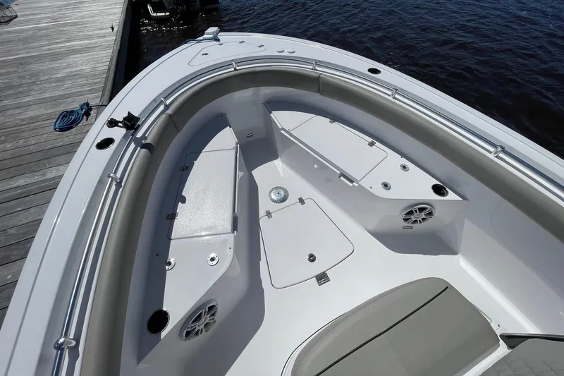 Slide: The Image of 2024 Sportsman Open 232 Center Console boat interior with seating and storage compartments. - 27