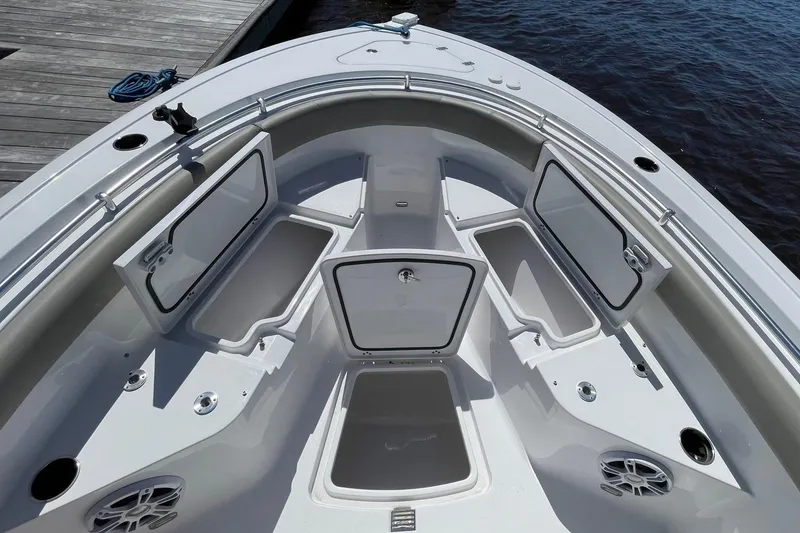 Slide: The Image of 2024 Sportsman Open 232 Center Console boat with open storage compartments. - 28