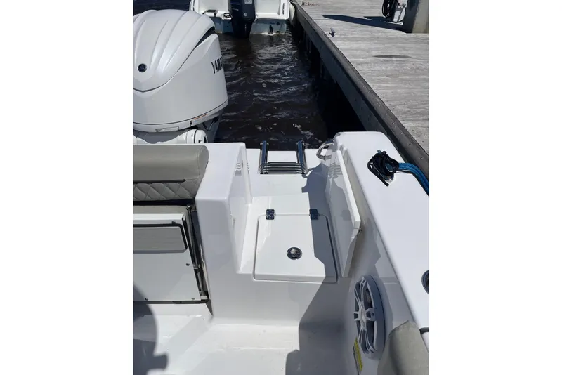 Slide: The Image of 2024 Sportsman Open 232 Center Console boat with Yamaha engine at dock. - 34