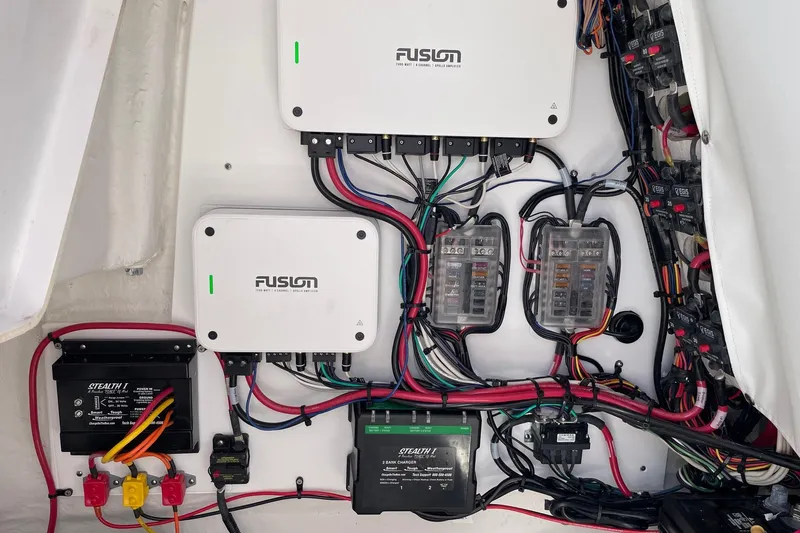 Slide: The Image of 2024 Sportsman Open 232 Center Console wiring with Fusion audio system and Stealth charger. - 42