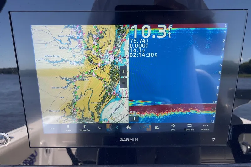 Slide: The Image of Garmin marine display on 2024 Sportsman Open 232 Center Console, showing navigation and sonar data. - 44