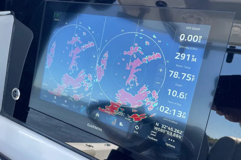 Slide: The Image of Garmin marine display on 2024 Sportsman Open 232 Center Console, showing radar and navigation data. - 47