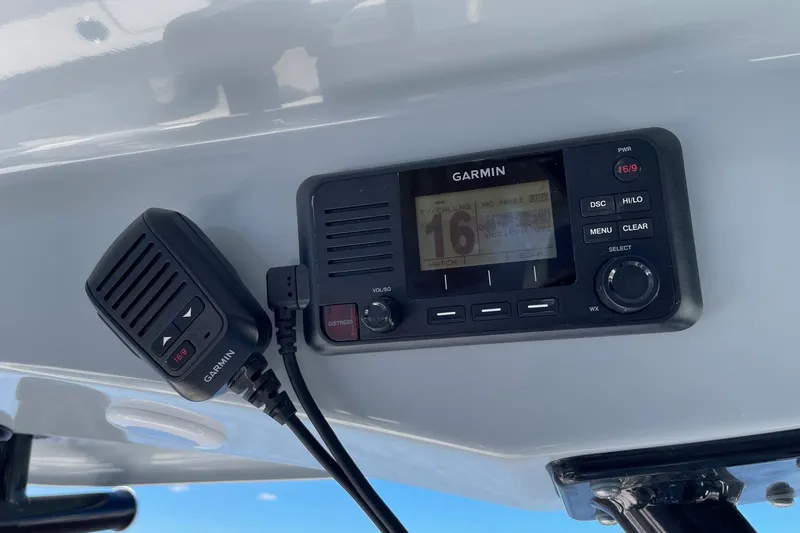 Slide: The Image of Garmin marine radio on 2024 Sportsman Open 232 Center Console boat. - 49