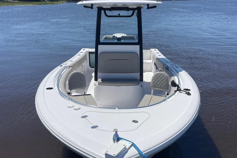 Slide: The Image of 2024 Sportsman Open 232 Center Console boat on calm water. - 5
