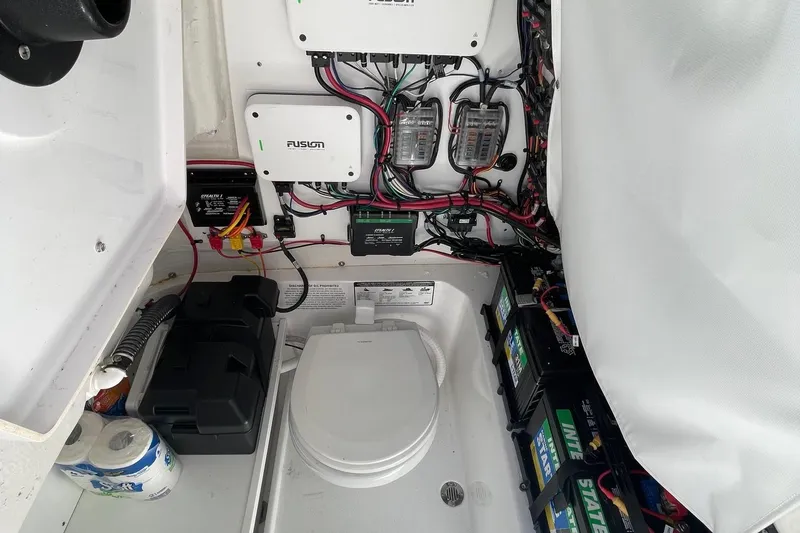 Slide: The Image of 2024 Sportsman Open 232 Center Console interior wiring and battery setup. - 65