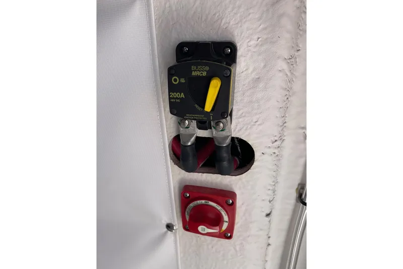 Slide: The Image of Electrical panel on 2024 Sportsman Open 232 Center Console boat, featuring a 200A circuit breaker. - 69