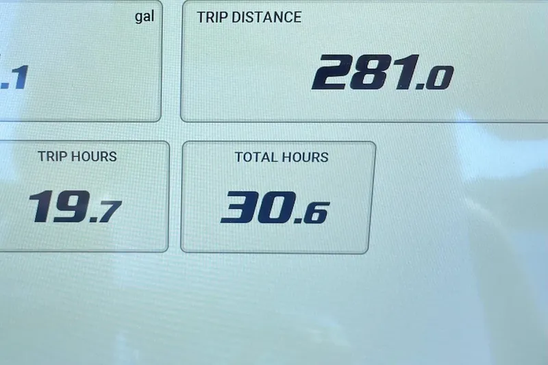 Slide: The Image of Display screen showing trip distance, hours, and total hours for 2024 Sportsman Open 232 Center Console. - 78