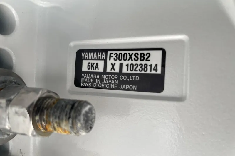 Slide: The Image of Yamaha F300XSB2 engine label on 2024 Sportsman Open 232 Center Console boat. - 79
