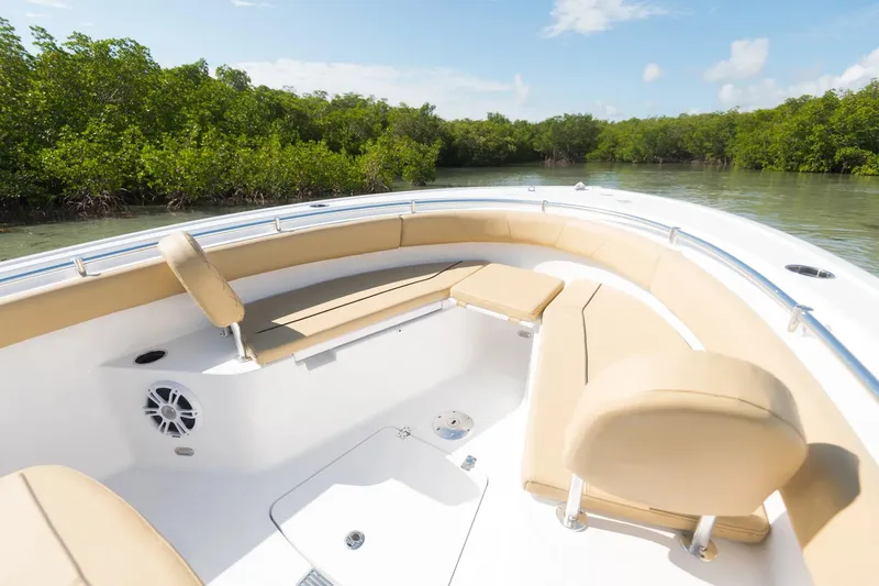 Slide: The Image of Manufacturer Provided Image: 2024 Sportsman Open 232 Center Console boat with tan seating in a scenic waterway. - 84