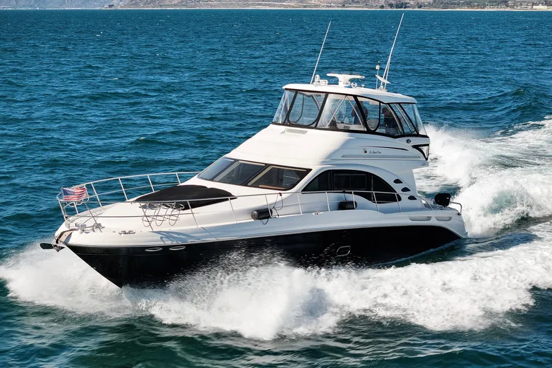 The Image of 2007 Sea Ray 580 Sedan Bridge yacht cruising on open water. - 0