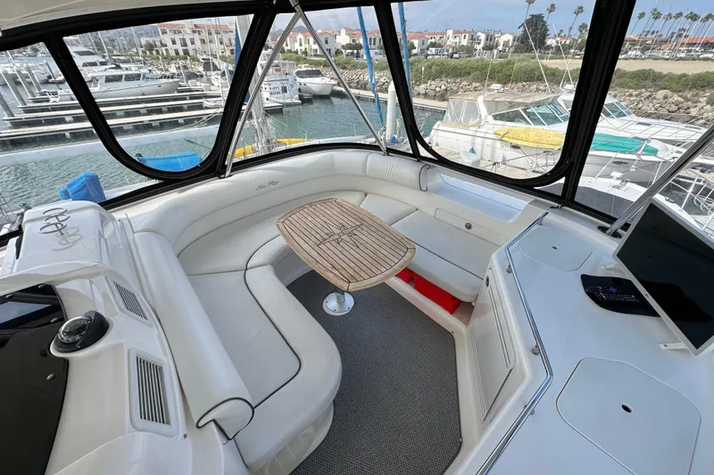Slide: The Image of Luxurious 2007 Sea Ray 580 Sedan Bridge interior with panoramic marina view. - 11