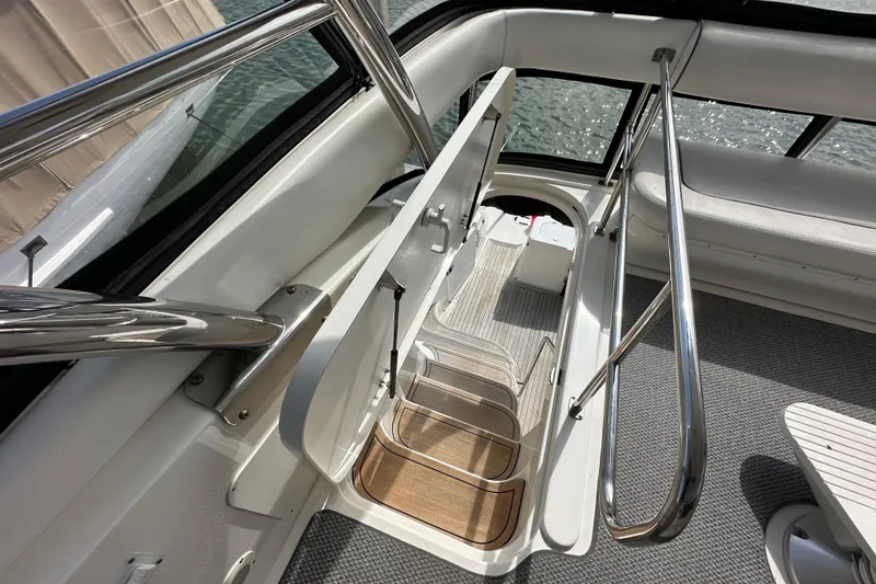 Slide: The Image of Interior view of 2007 Sea Ray 580 Sedan Bridge yacht with sleek stairs and railing. - 12