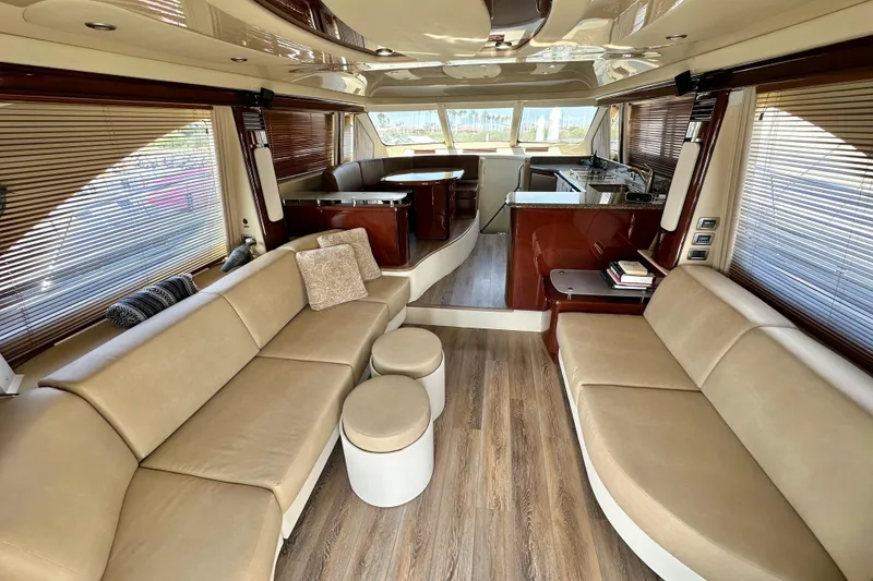 Slide: The Image of Luxurious interior of 2007 Sea Ray 580 Sedan Bridge yacht with elegant seating and modern design. - 13