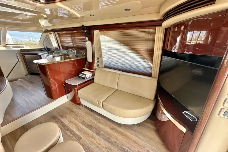 Slide: The Image of Luxurious interior of 2007 Sea Ray 580 Sedan Bridge yacht with modern furnishings. - 16