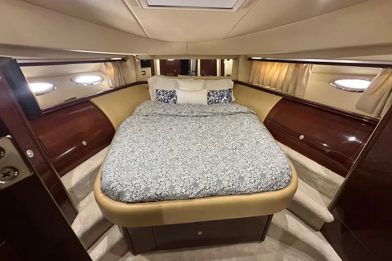 Slide: The Image of Luxurious bedroom interior of 2007 Sea Ray 580 Sedan Bridge yacht. - 24