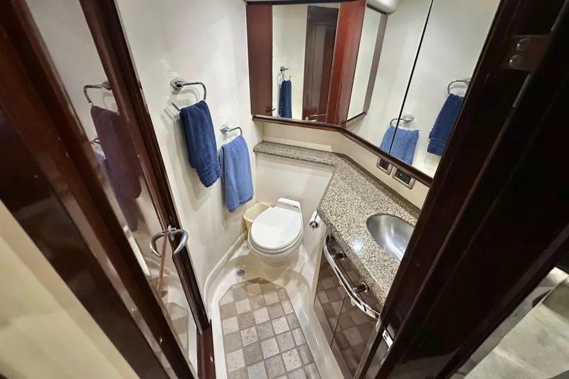 Slide: The Image of Luxurious bathroom in 2007 Sea Ray 580 Sedan Bridge yacht with granite countertop. - 25