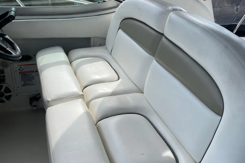 Slide: The Image of 2007 Sea Ray 300 Sundancer interior with white and gray seating. - 11