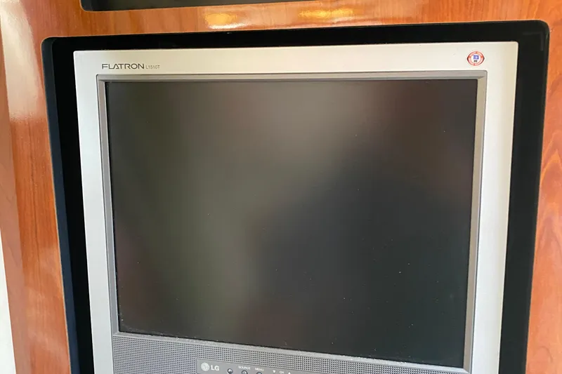 Slide: The Image of LG Flatron monitor on 2007 Sea Ray 300 Sundancer yacht, wooden panel background. - 21