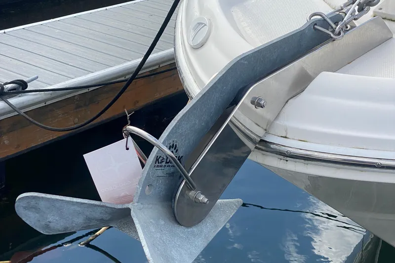 Slide: The Image of Anchor on a 2007 Sea Ray 300 Sundancer boat docked at a marina. - 7