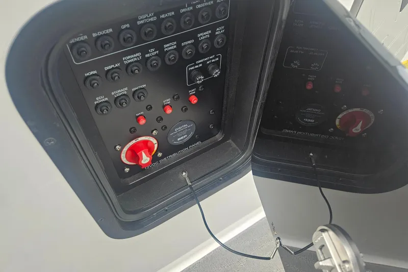 Slide: The Image of Control panel of a 2016 MasterCraft X23 boat with various switches and dials. - 10