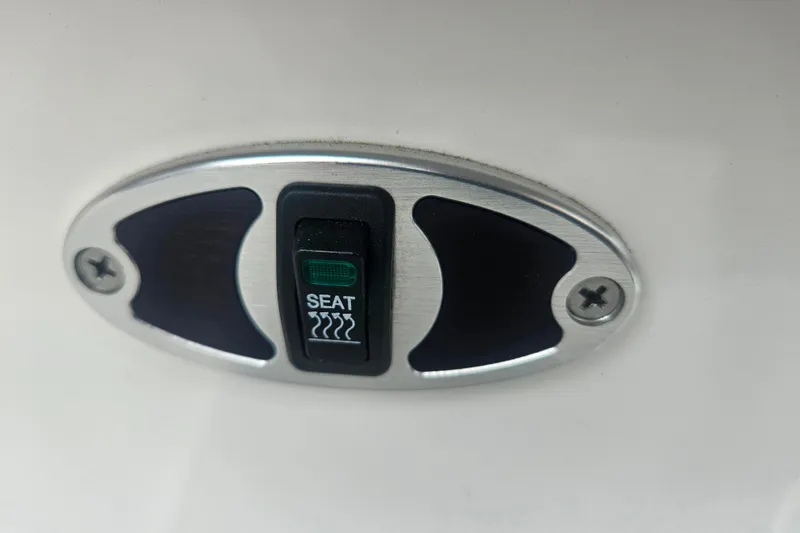 Slide: The Image of Heated seat switch on 2016 MasterCraft X23 boat. - 13