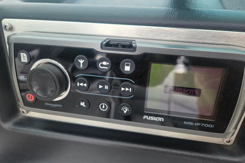 Slide: The Image of Fusion MS-IP700i stereo system in 2016 MasterCraft X23 boat dashboard. - 16