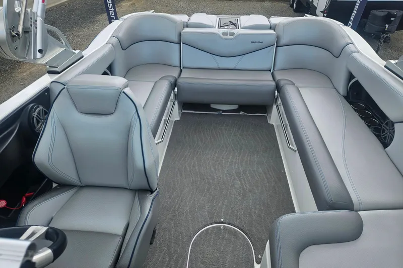 Slide: The Image of 2016 MasterCraft X23 boat interior with gray seating and modern design. - 4